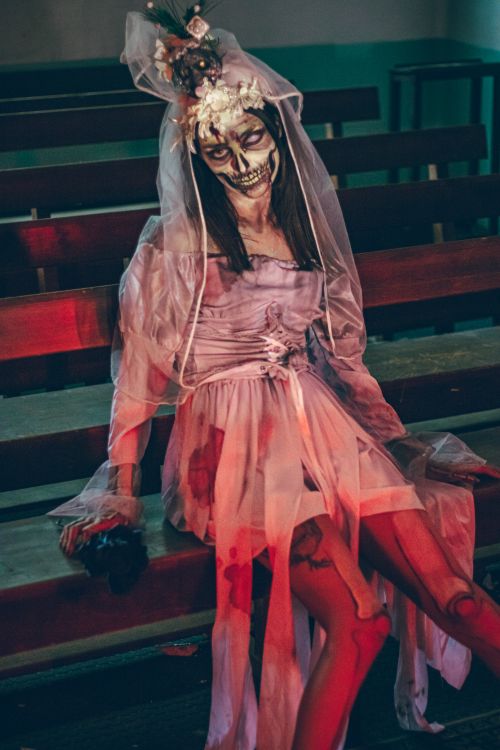 Free A spooky Halloween-themed cosplay with artistic makeup and bridal costume. Stock Photo