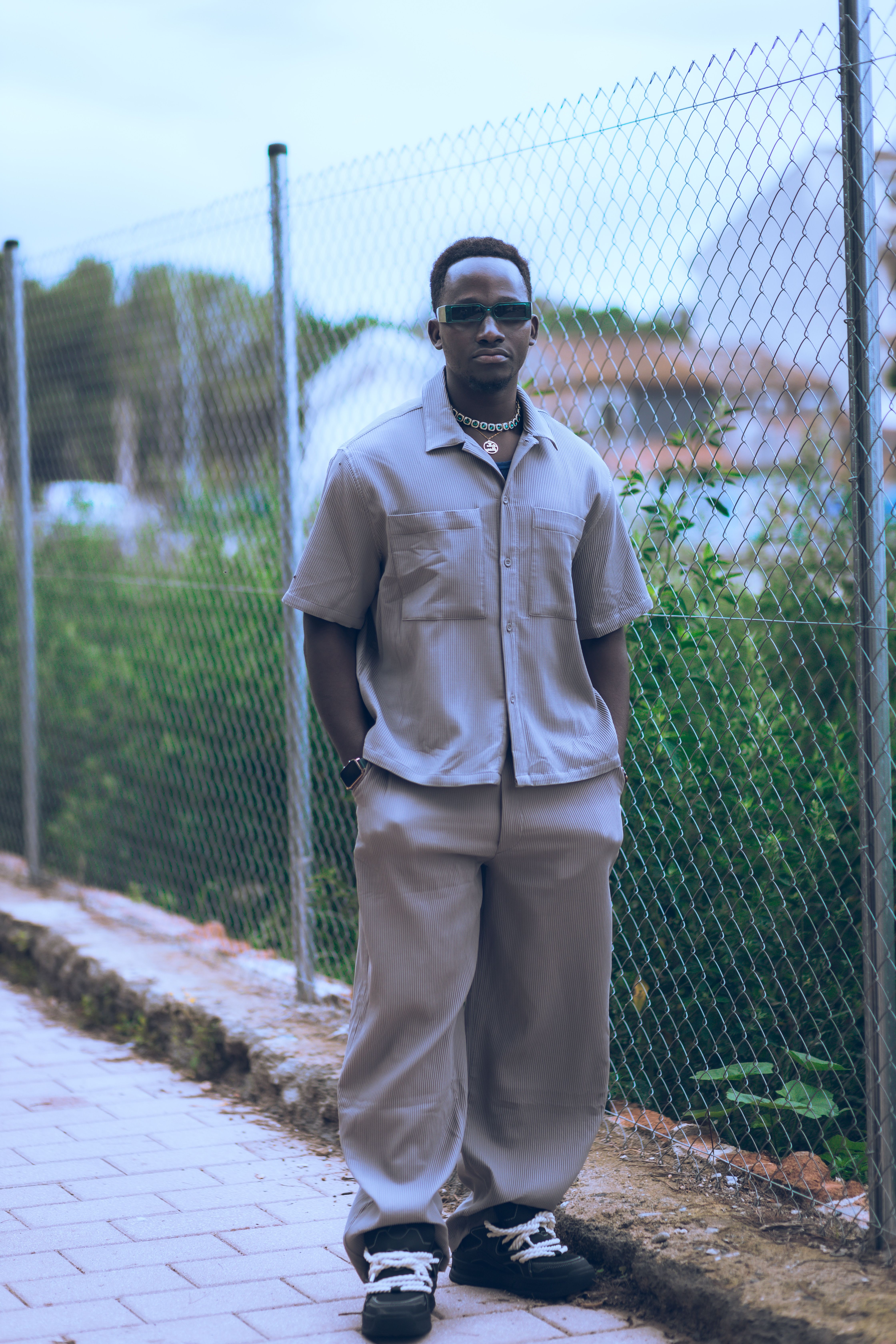 Stylish Man Posing Outdoors in Urban Setting · Free Stock Photo