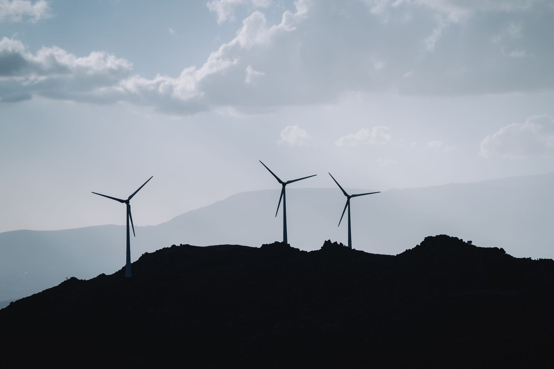 Wind turbines along the Ngong Hills ridge above the Rift Valley floor