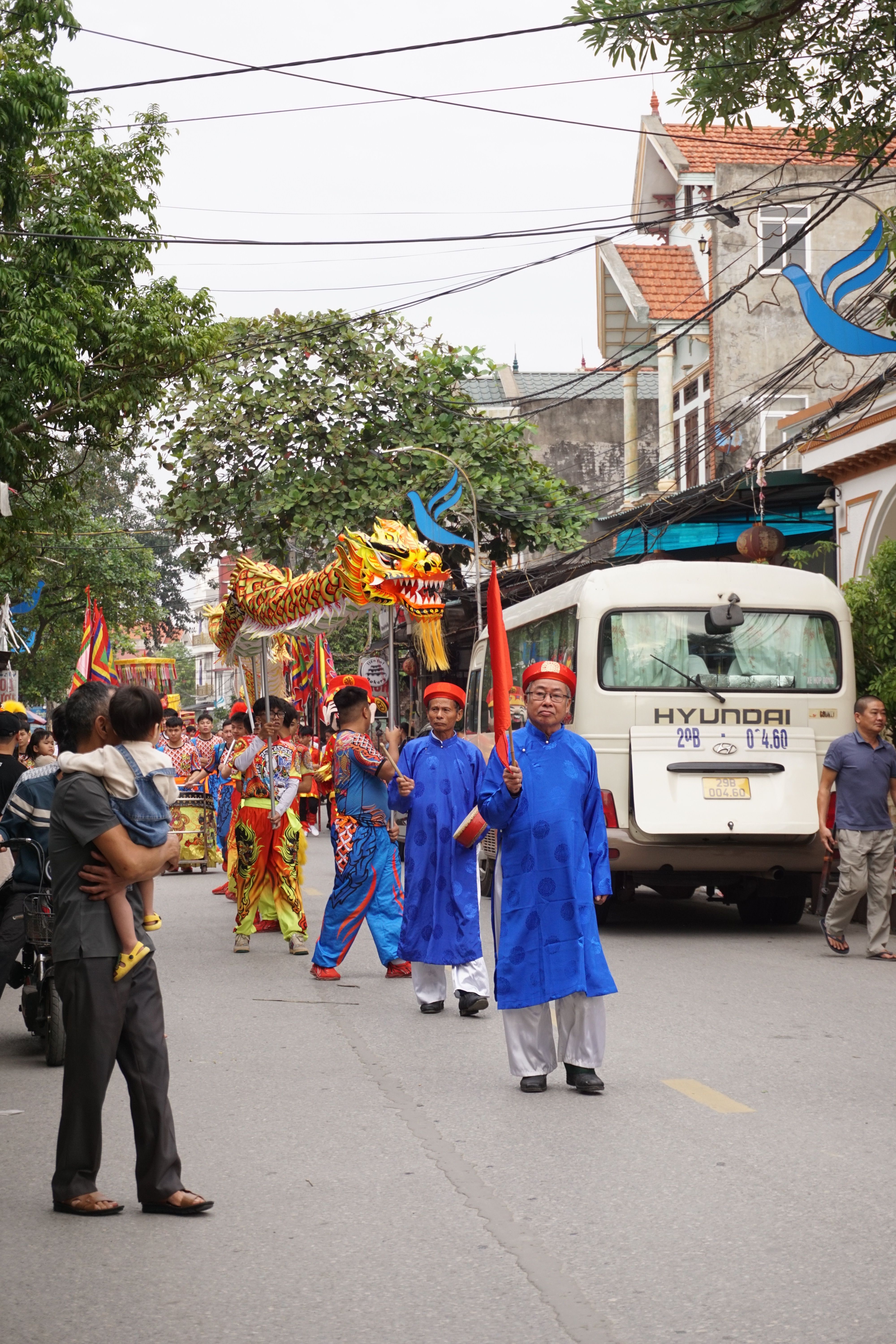 Vibrant Street Parade with Traditional Asian Dragon · Free Stock Photo