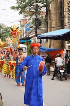 A colorful dragon dance parade captivating the urban street crowd with cultural vibrancy.