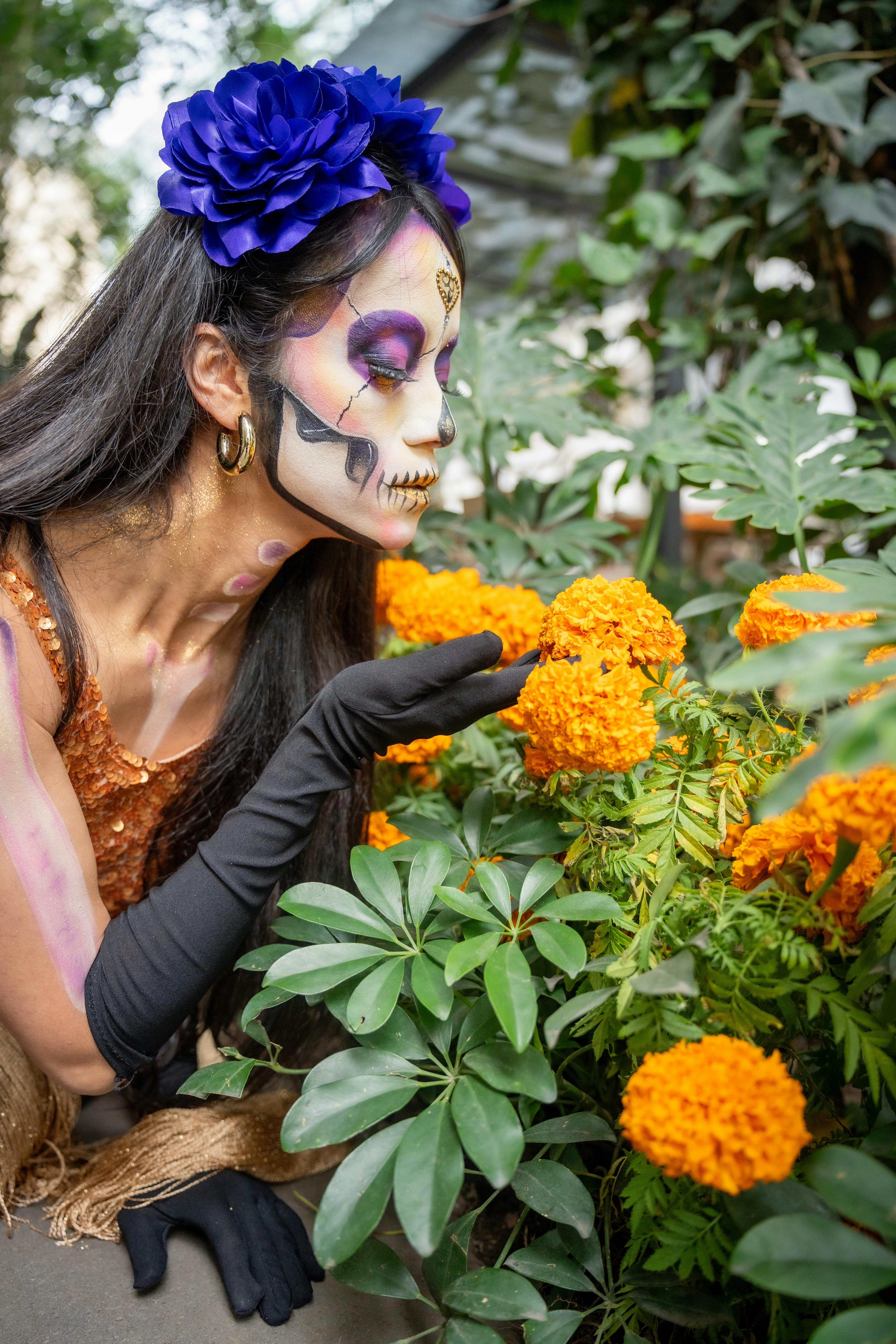 colorful dia de muertos makeup and marigolds