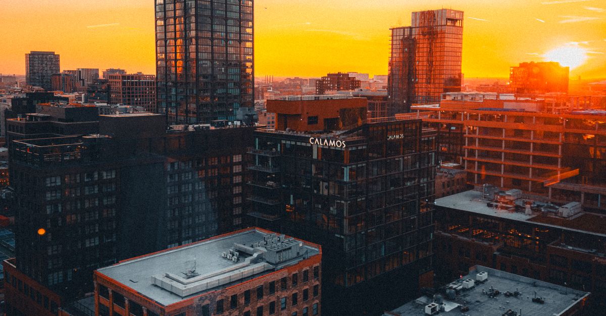 Sunset Over Urban Skyline with Modern Buildings · Free Stock Photo