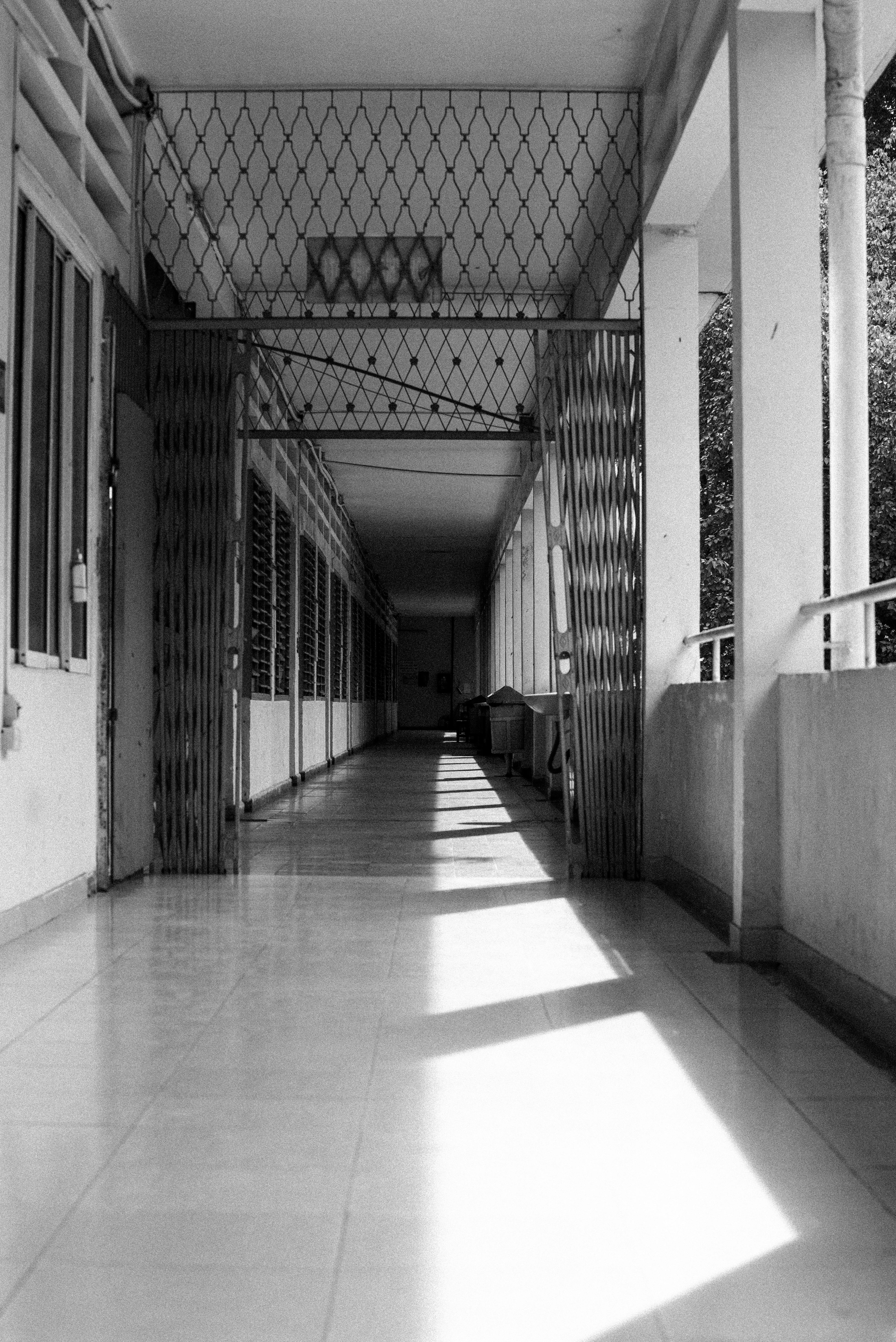 Black and white photograph of a deserted corridor in Sai Gon University, Vietnam.