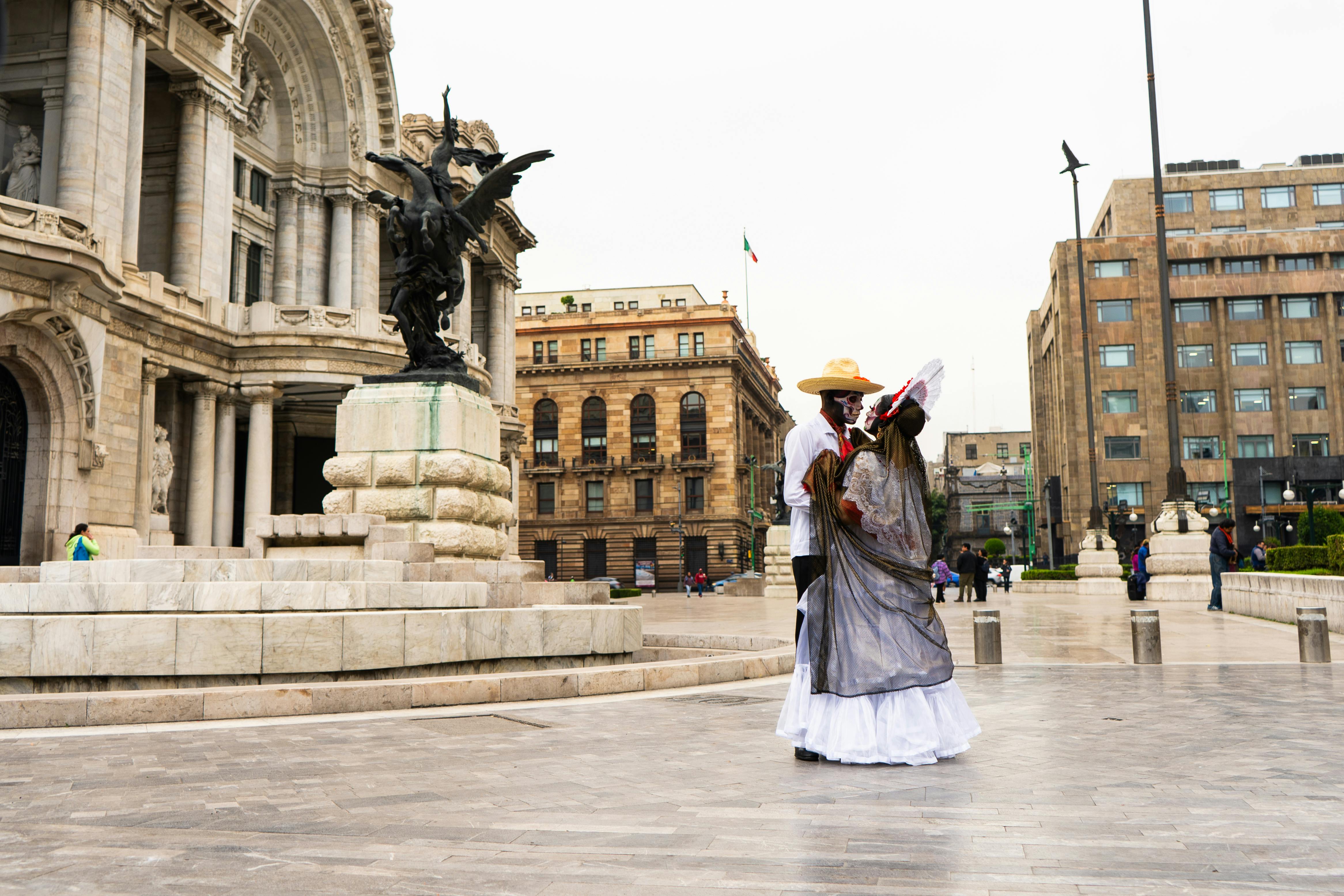 traditional catrina couple at palacio de bellas artes