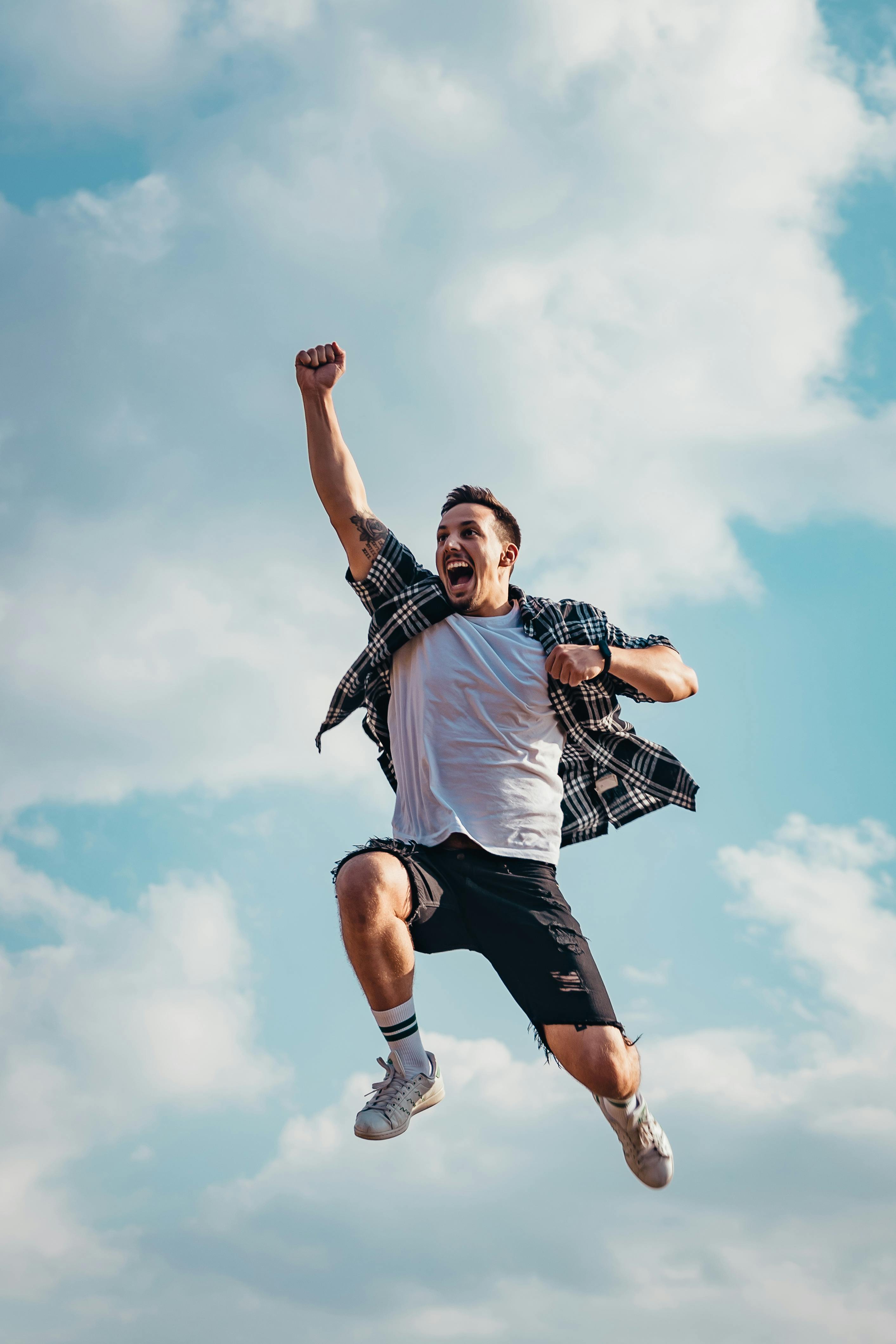 very happy man jumping