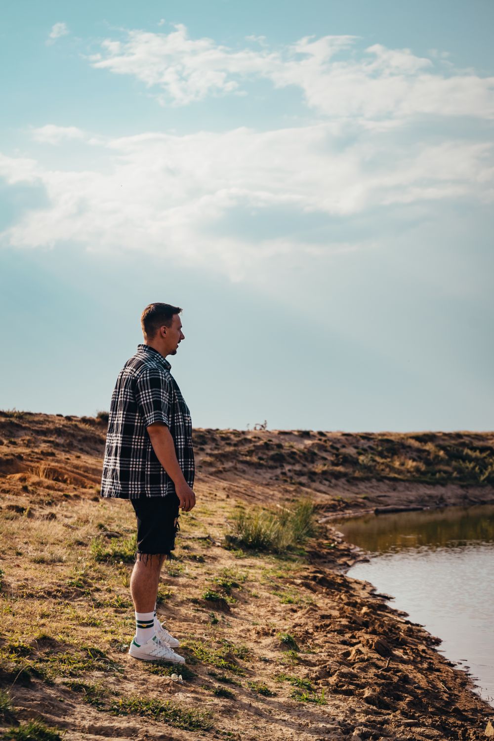 Man Standing Near Body of Water · Free Stock Photo