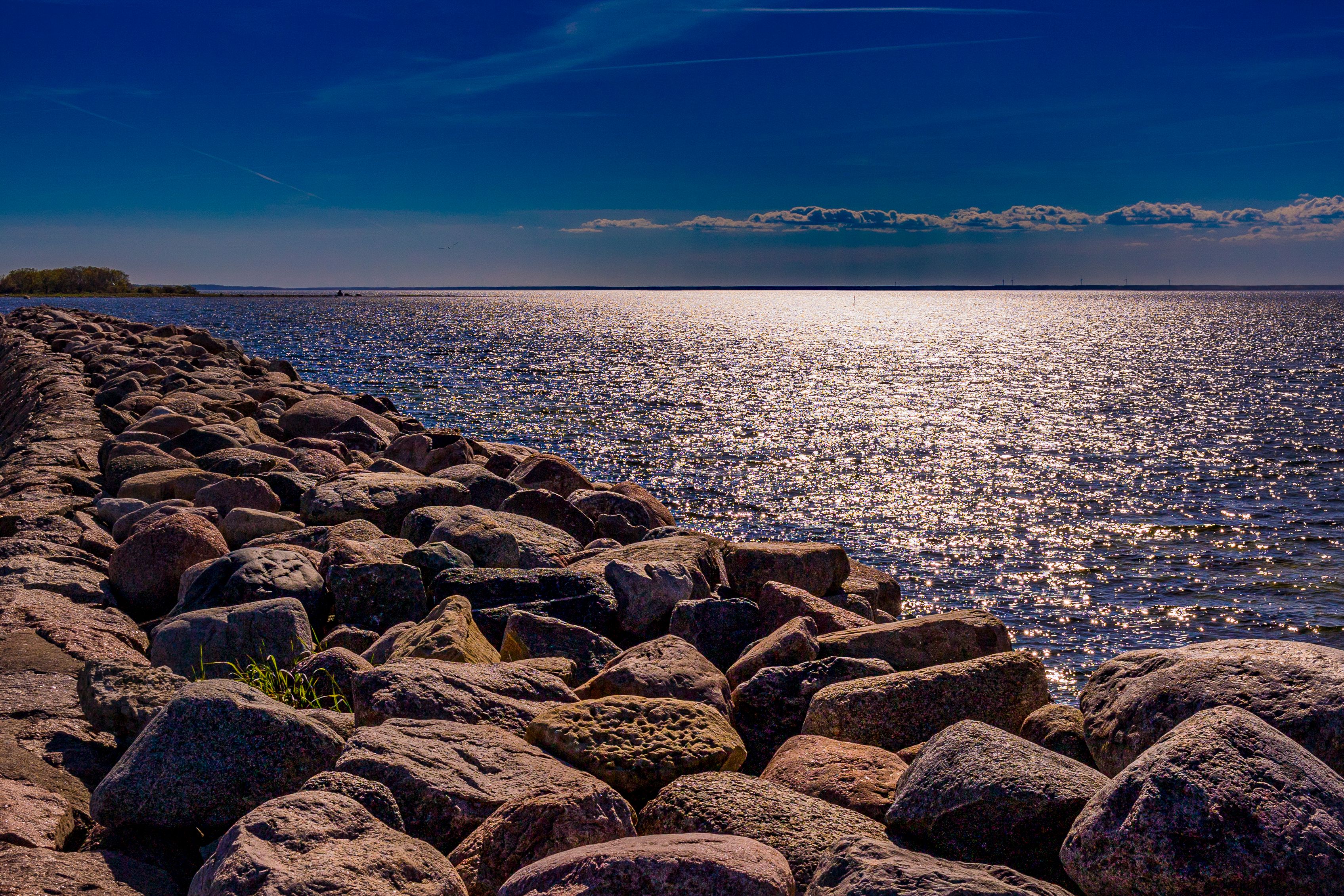 Stunning sunset over rocky coast at Öland, Sweden. Perfect tranquil scene for nature enthusiasts.