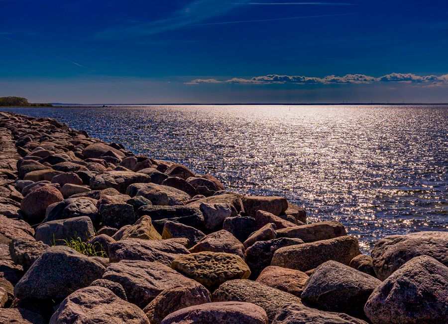 Stunning sunset over rocky coast at Öland, Sweden. Perfect tranquil scene for nature enthusiasts.
