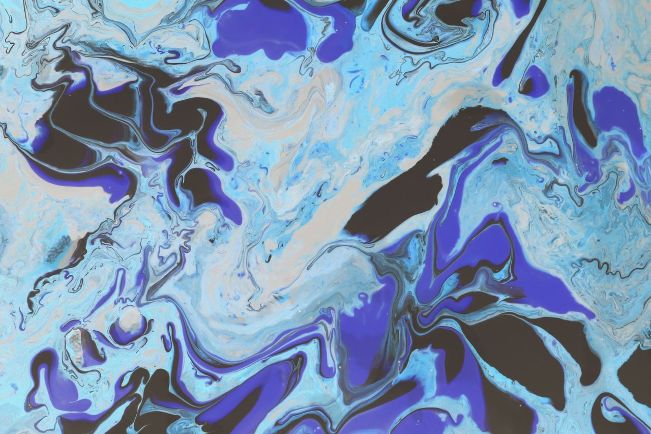 a dynamic abstract artwork showcasing swirling patterns of blue and bl
