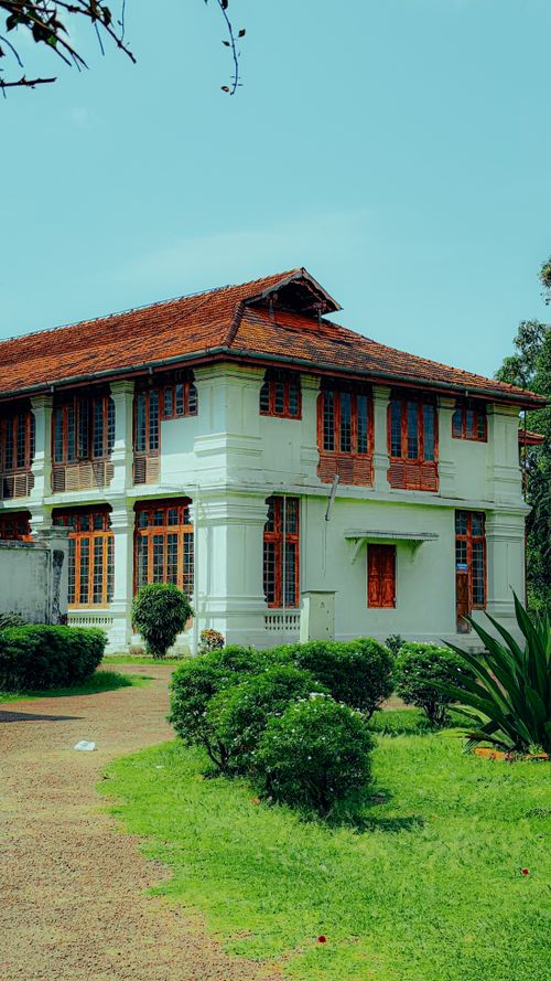 Free Elegant colonial architecture in lush gardens, Ernakulam, India. Stock Photo