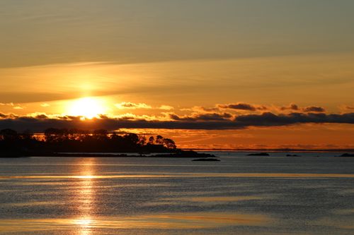 Free Serene sunrise with reflections over water in Stamford, Connecticut, highlighting autumn colors. Stock Photo