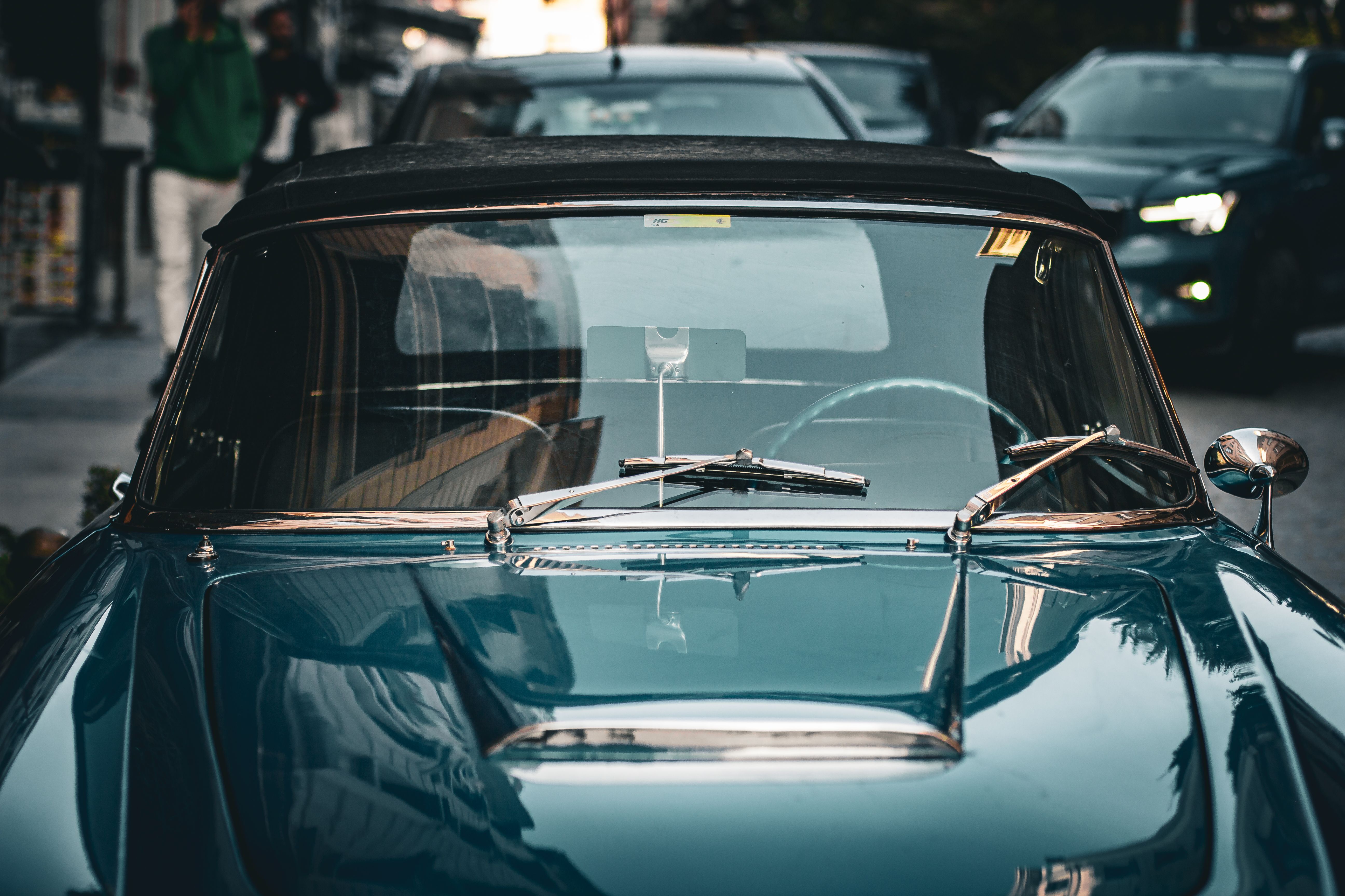 Front view of a vintage blue convertible car on the street · Free Stock ...