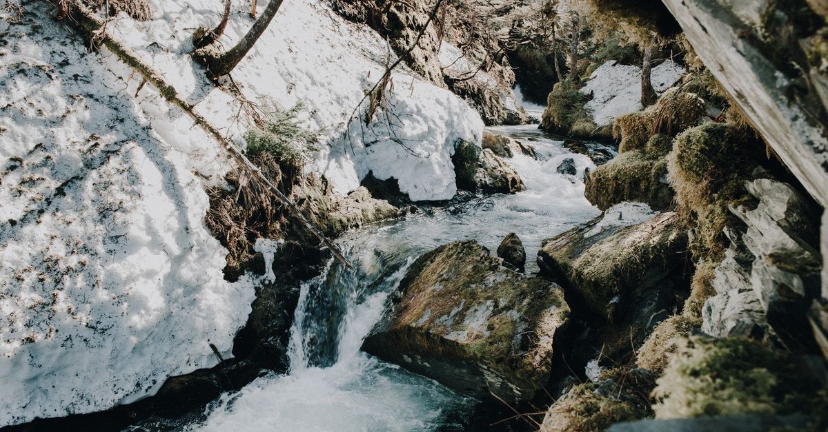 Colorado mountain river spring snowmelt, hot springs steam rising, Rocky Mountains wilderness