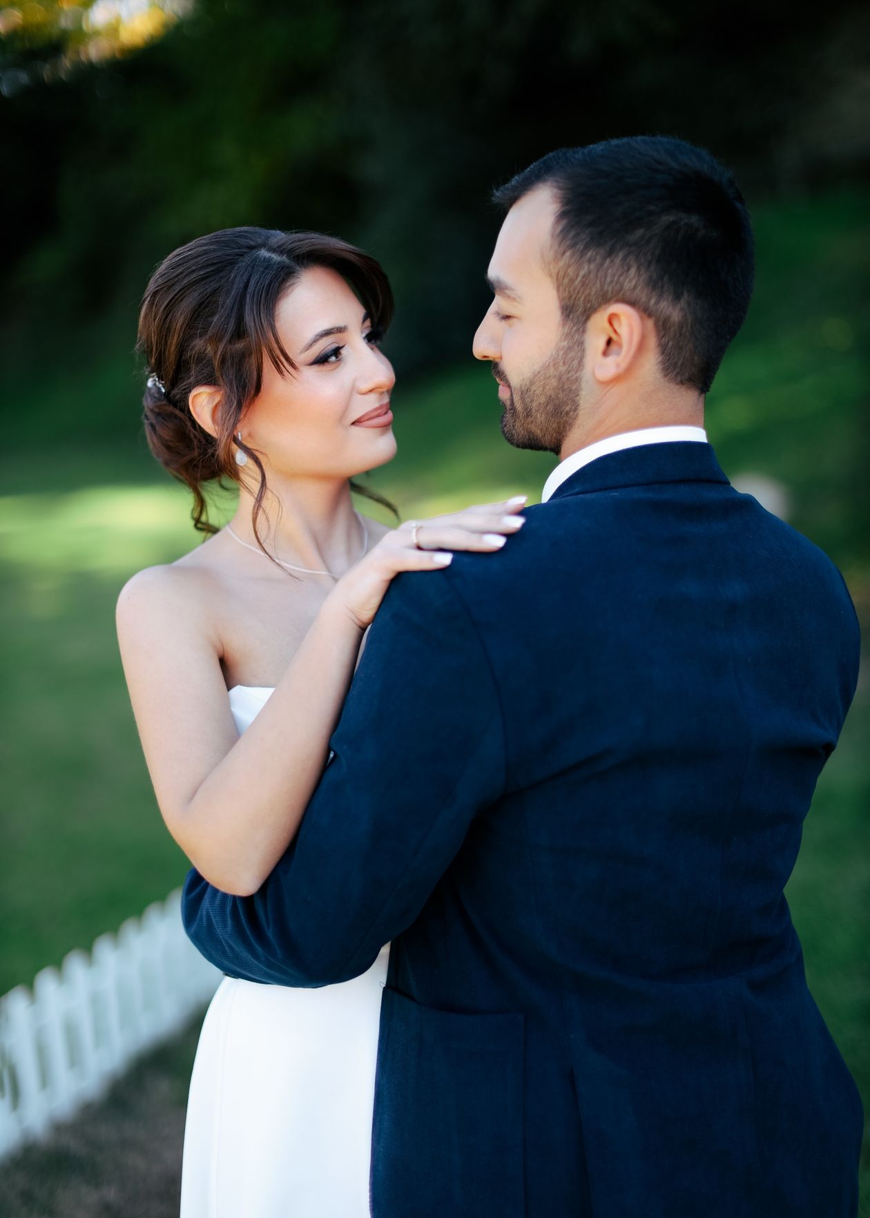 Bride and groom embracing outdoors at a Tannin Ridge vineyard wedding