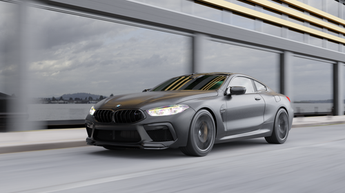 Sleek BMW Car Driving Along Ocean Road · Free Stock Photo