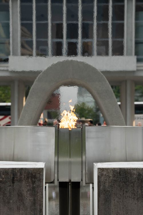 Free Symbolic eternal flame at Hiroshima Peace Memorial Park on a serene day. Stock Photo