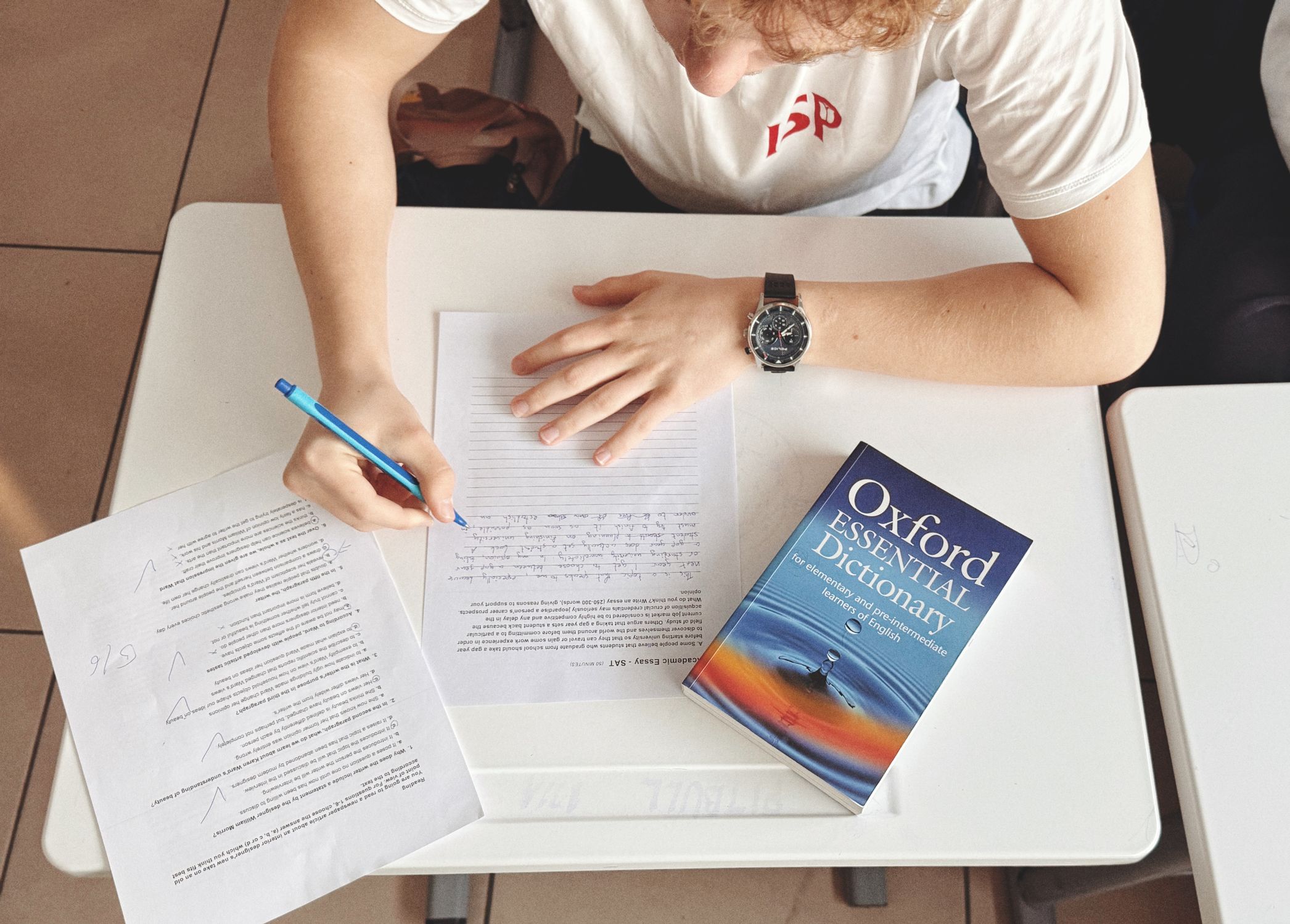 Dictionary Reading/writing Student Writing Test with Oxford Dictionary at Desk · Free Stock Photo