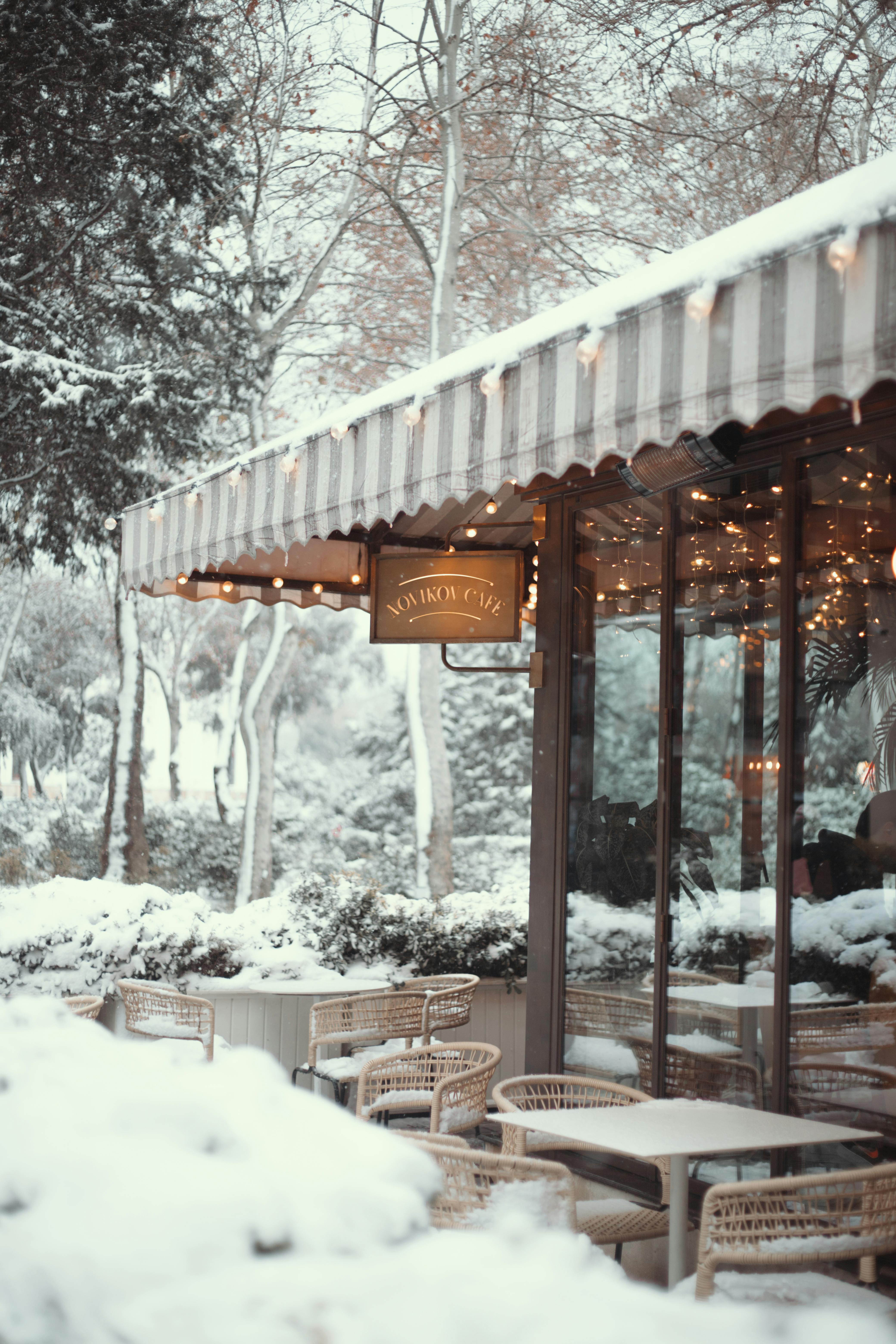 Charming snow-covered café in Baku, Azerbaijan, offering a cozy winter ambiance.