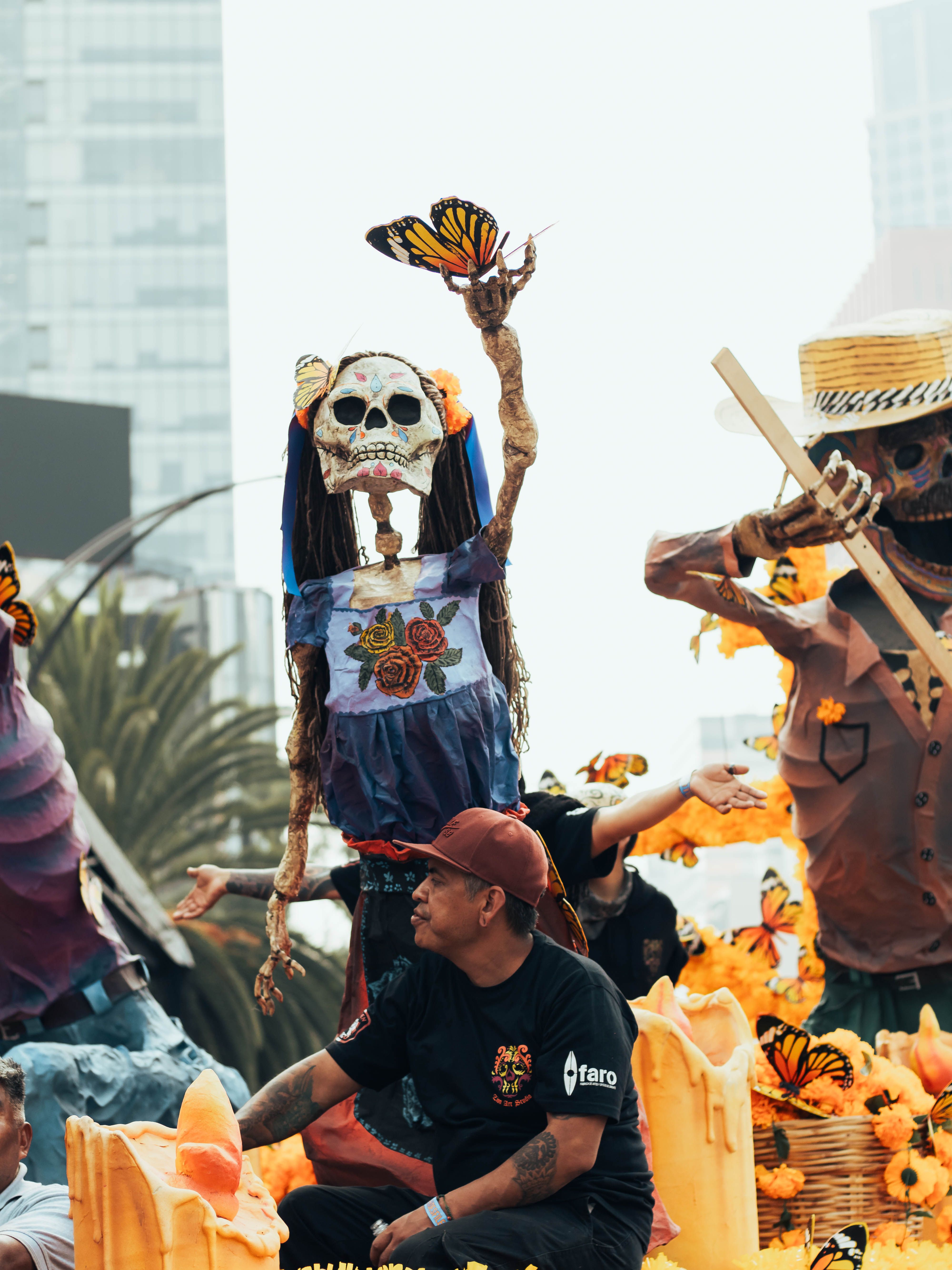 Colorful Day of the Dead parade with skeleton figures in Mexico City, rich in tradition and vibrant culture.