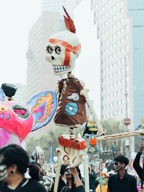 Free Colorful Day of the Dead parade with skeletons and decorations in Mexico City. Stock Photo