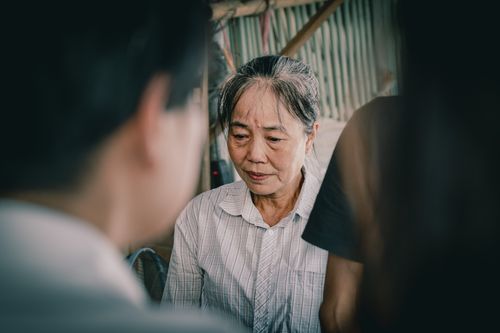 Free A senior woman deep in thought captured in a candid moment indoors. Stock Photo
