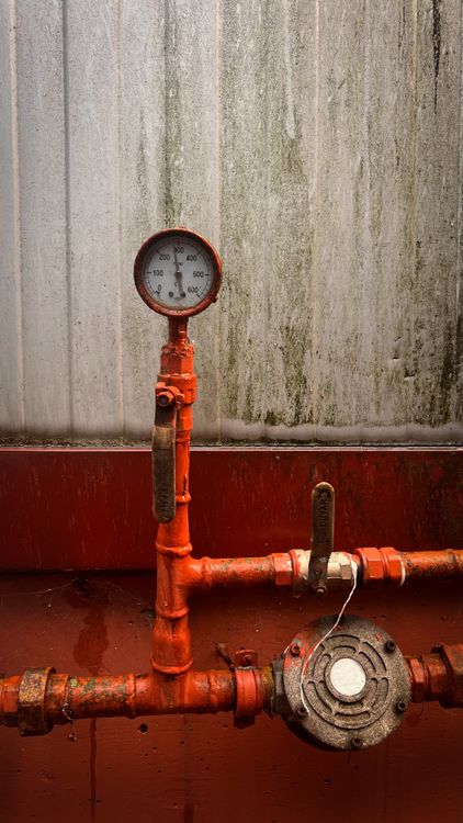 Industrial Pressure Gauge on Red Piping in Türkiye · Free Stock Photo