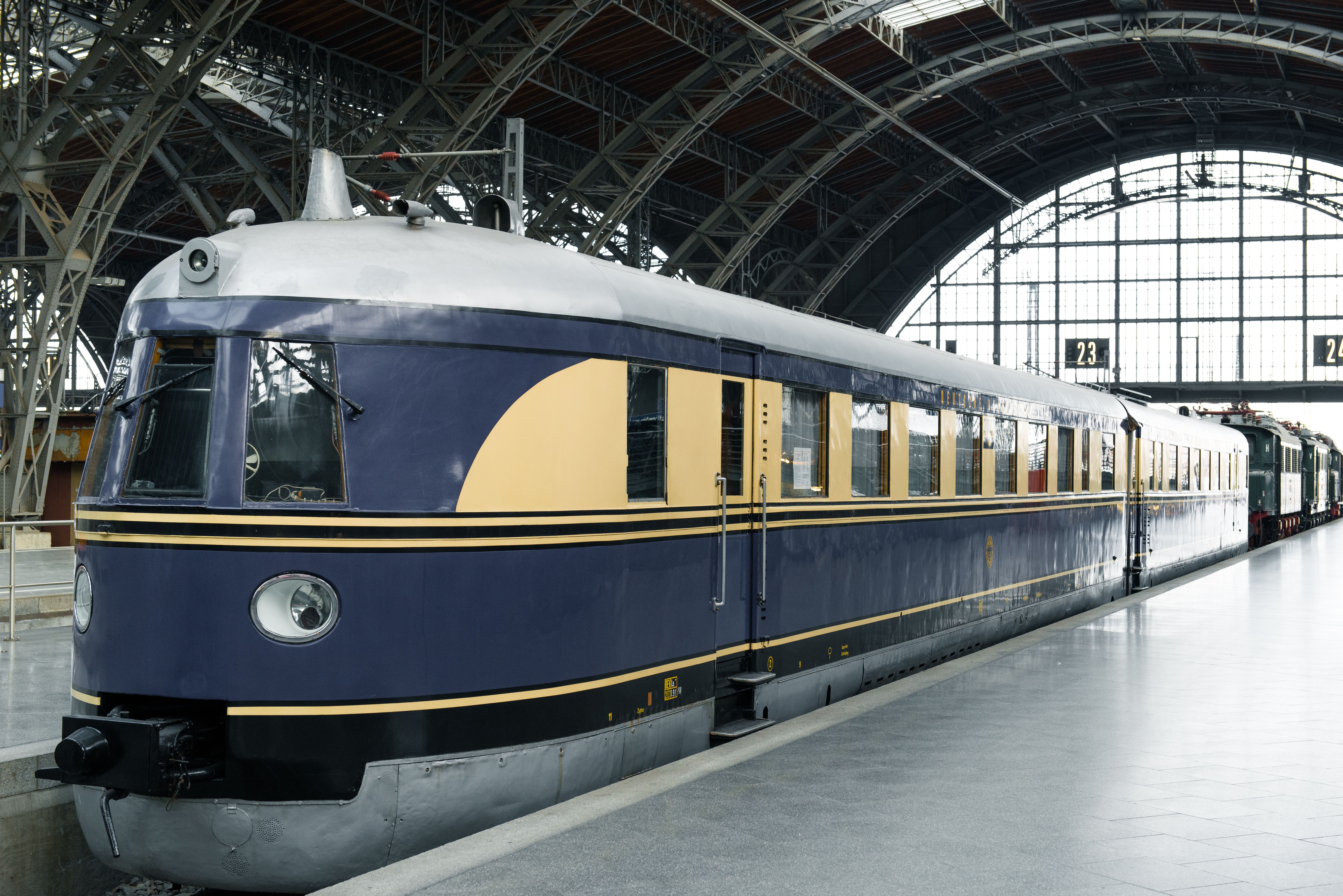 Vintage train at Leipzig Hauptbahnhof under soaring iron arches