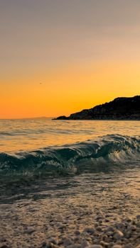 Serene waves at sunset along a Türkiye beachscape, capturing nature's beauty.