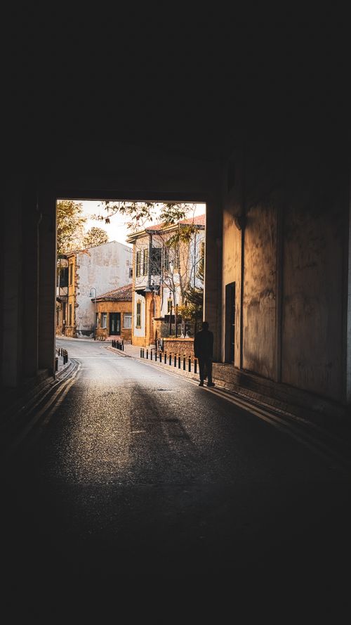 Free A tranquil view of an alleyway in Lefkoşa, capturing historic architecture and soft lighting. Stock Photo