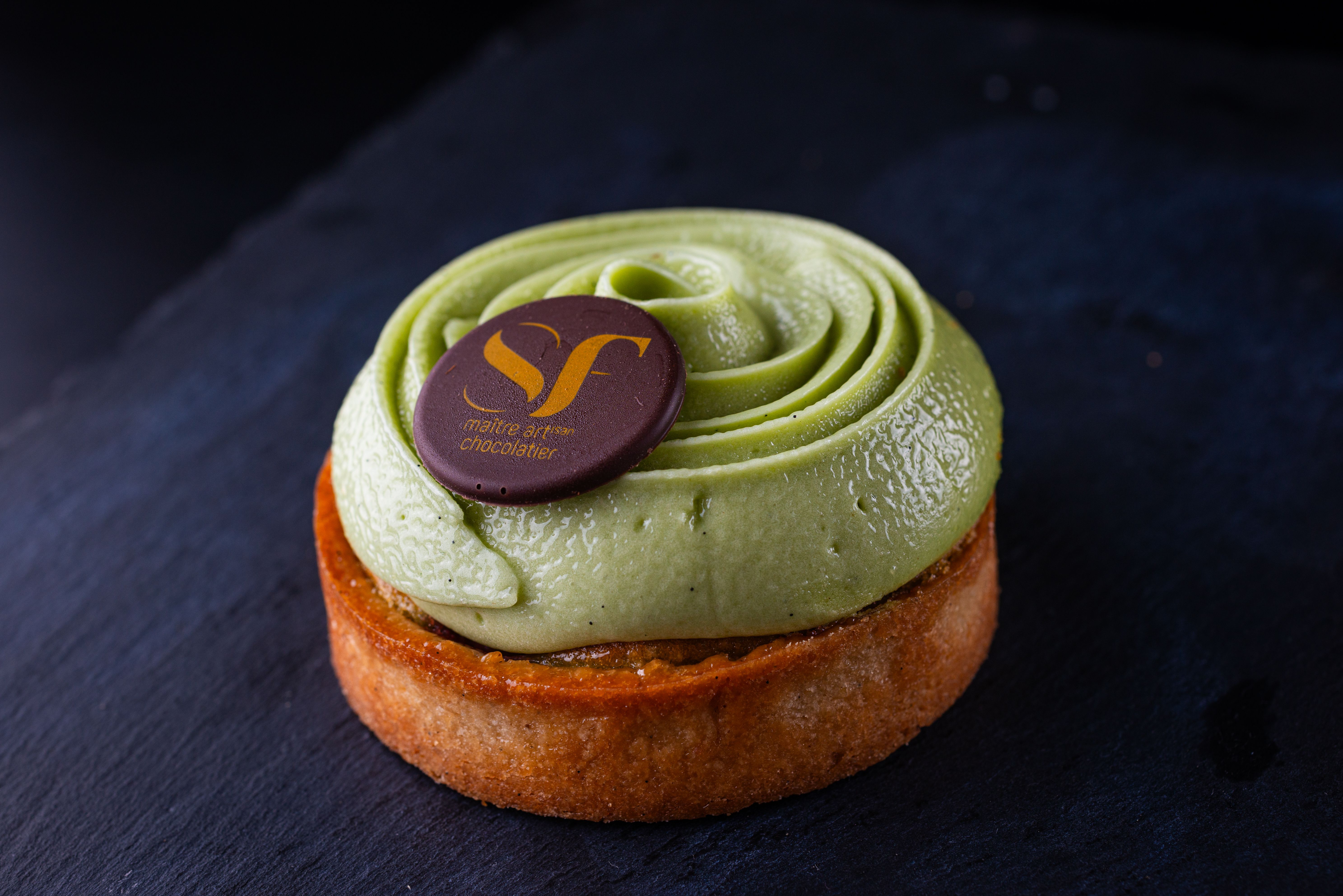Elegant Matcha Pistachio Tart with Chocolate Decoration · Free Stock Photo
