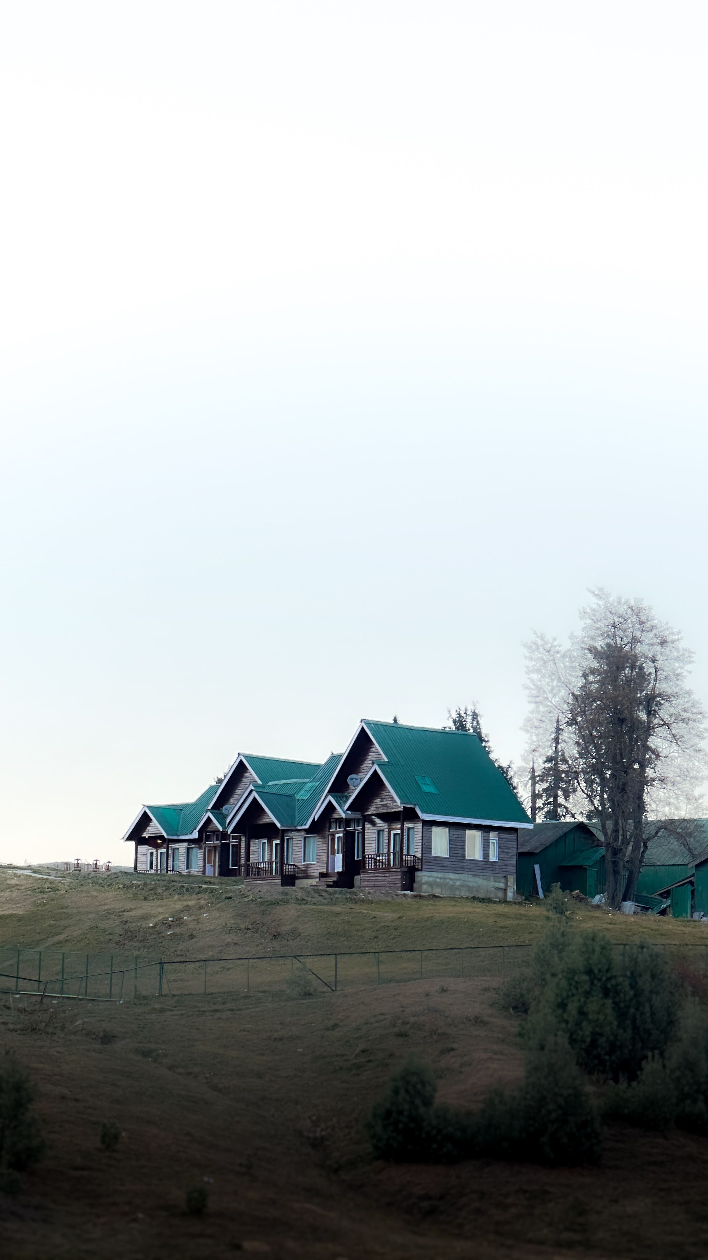 Scenic Countryside House in Misty Mountain Landscape · Free Stock Photo