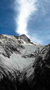 Breathtaking view of a snow-covered mountain under a clear blue sky.