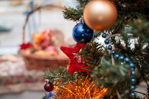 Free Close-up of a festive Christmas tree with vibrant ornaments and decorations. Stock Photo
