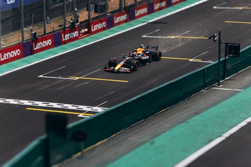 Free A Formula 1 car speeds down the track during a race, showcasing high performance. Stock Photo