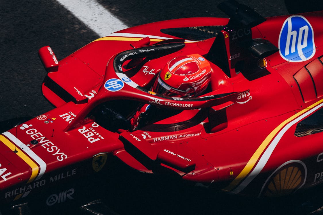 Dynamic Red Racing Car in Action on Track · Free Stock Photo