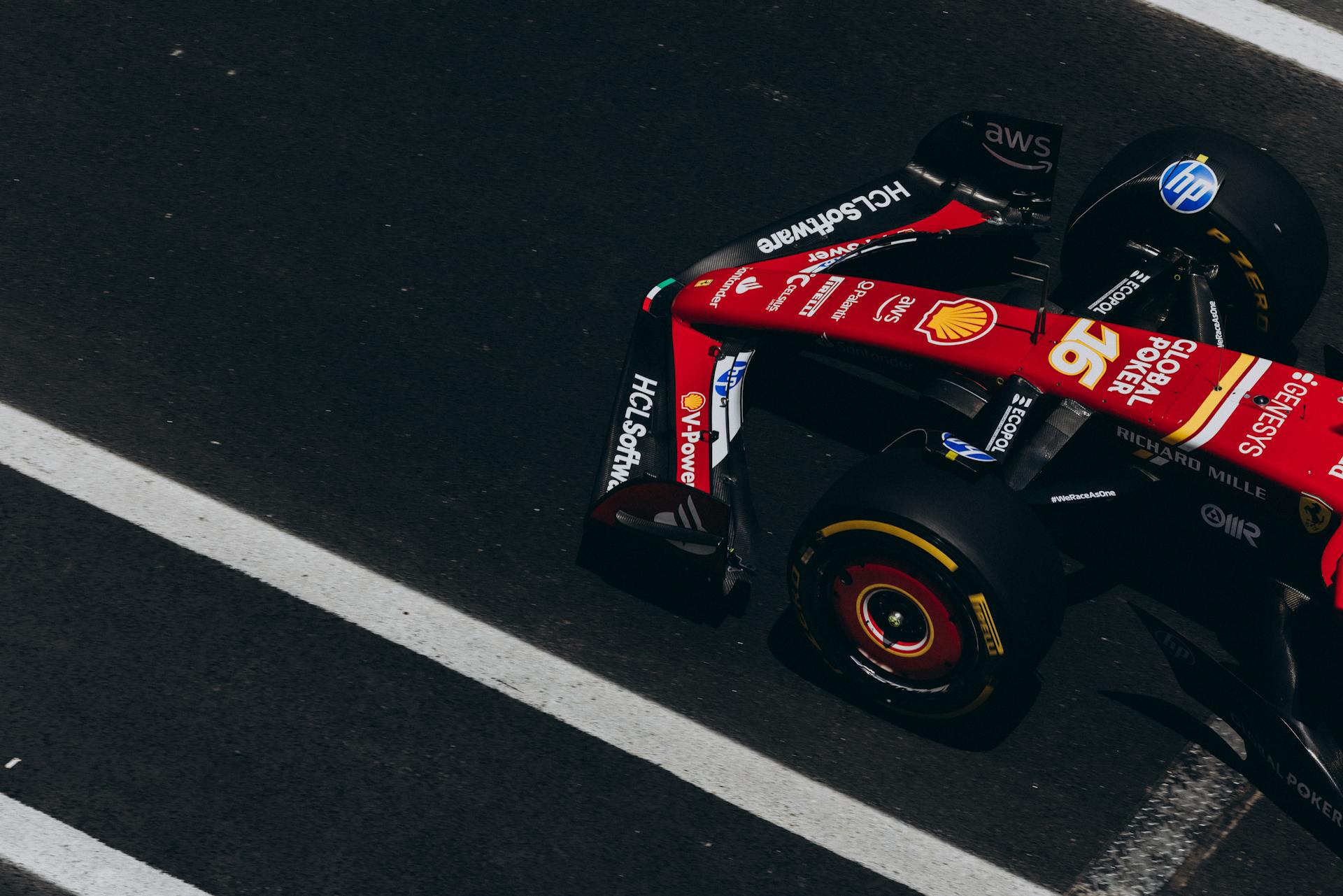 Dynamic overhead shot of a Formula One race car speeding on a track, showcasing high-speed action and racing dynamics.