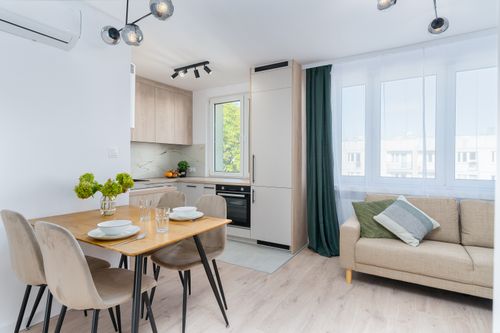 Free Bright kitchen with dining area in Scandinavian style, featuring minimalist design. Stock Photo