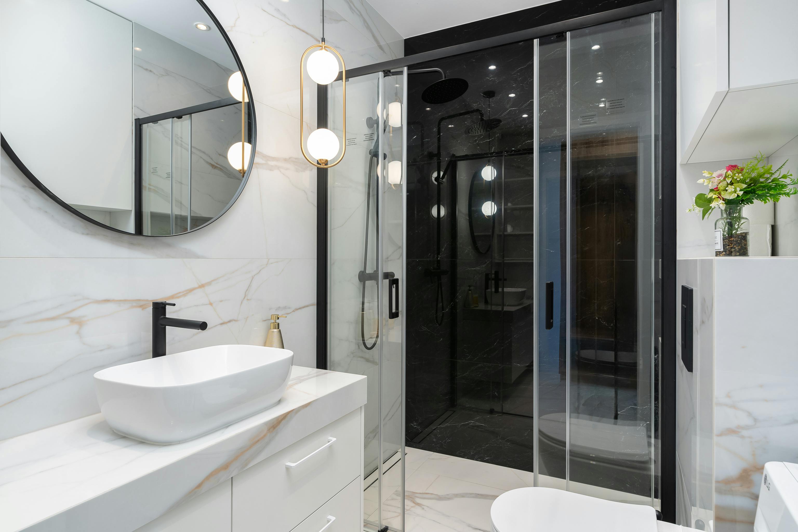 Frameless Bathroom Mirrors With Black Spots And An Unfinished Look