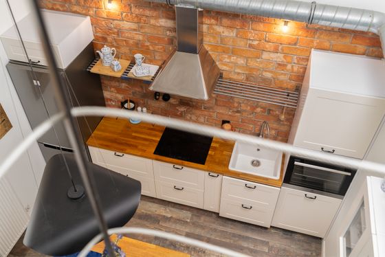 Loft kitchen with exposed brick, by Mateusz Pielech on Pexels