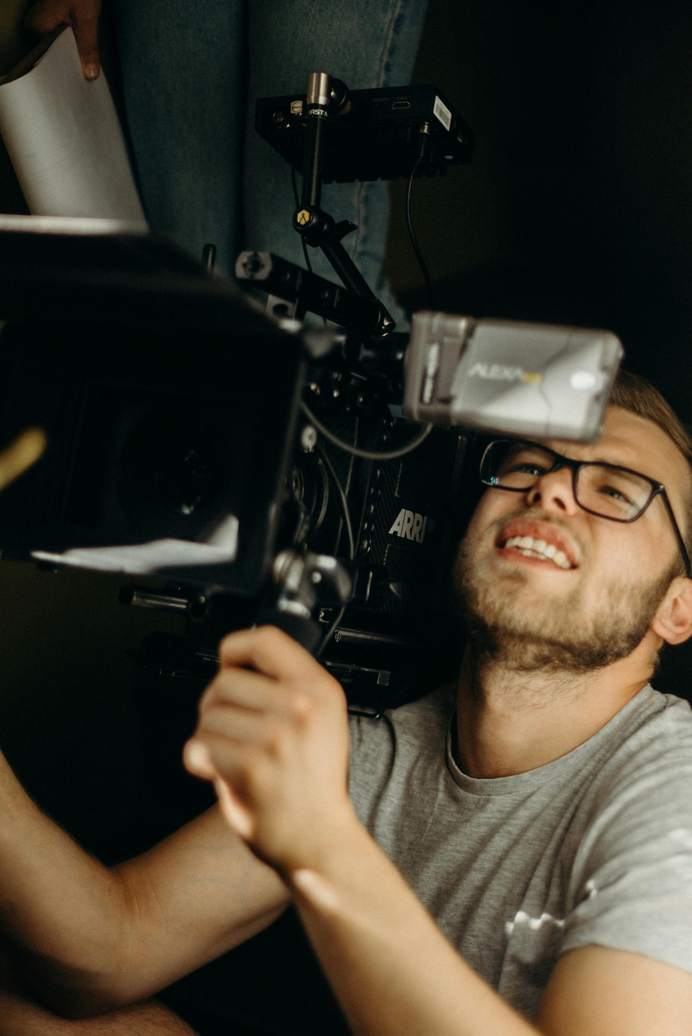 man carrying camera