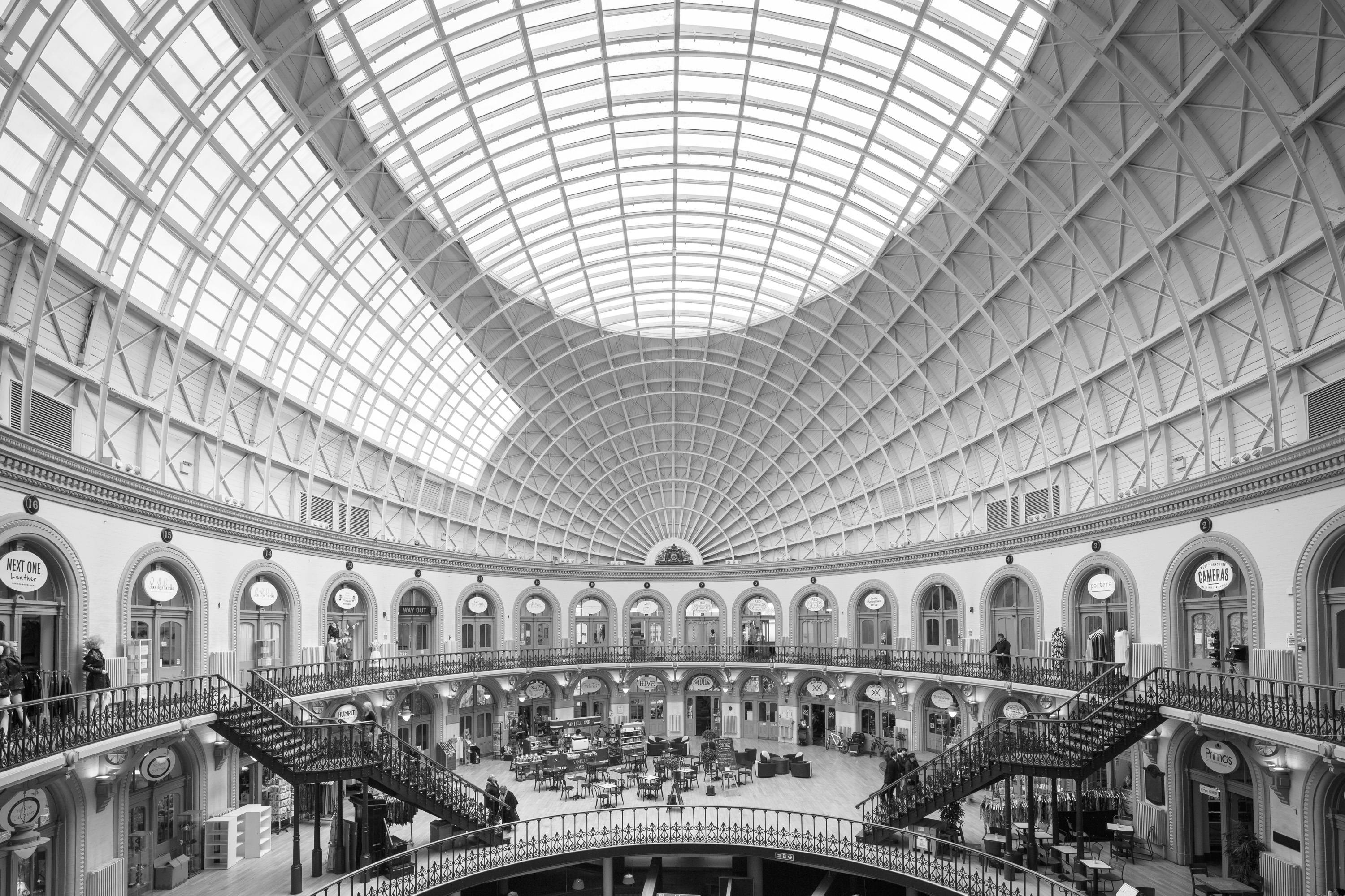 Majestic domed interior with classic architecture and expansive glass ceiling.