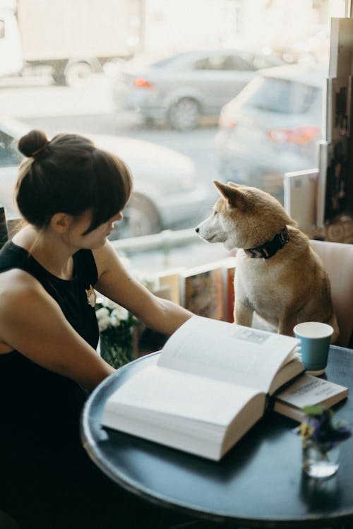 Photo Of Woman Beside Dog