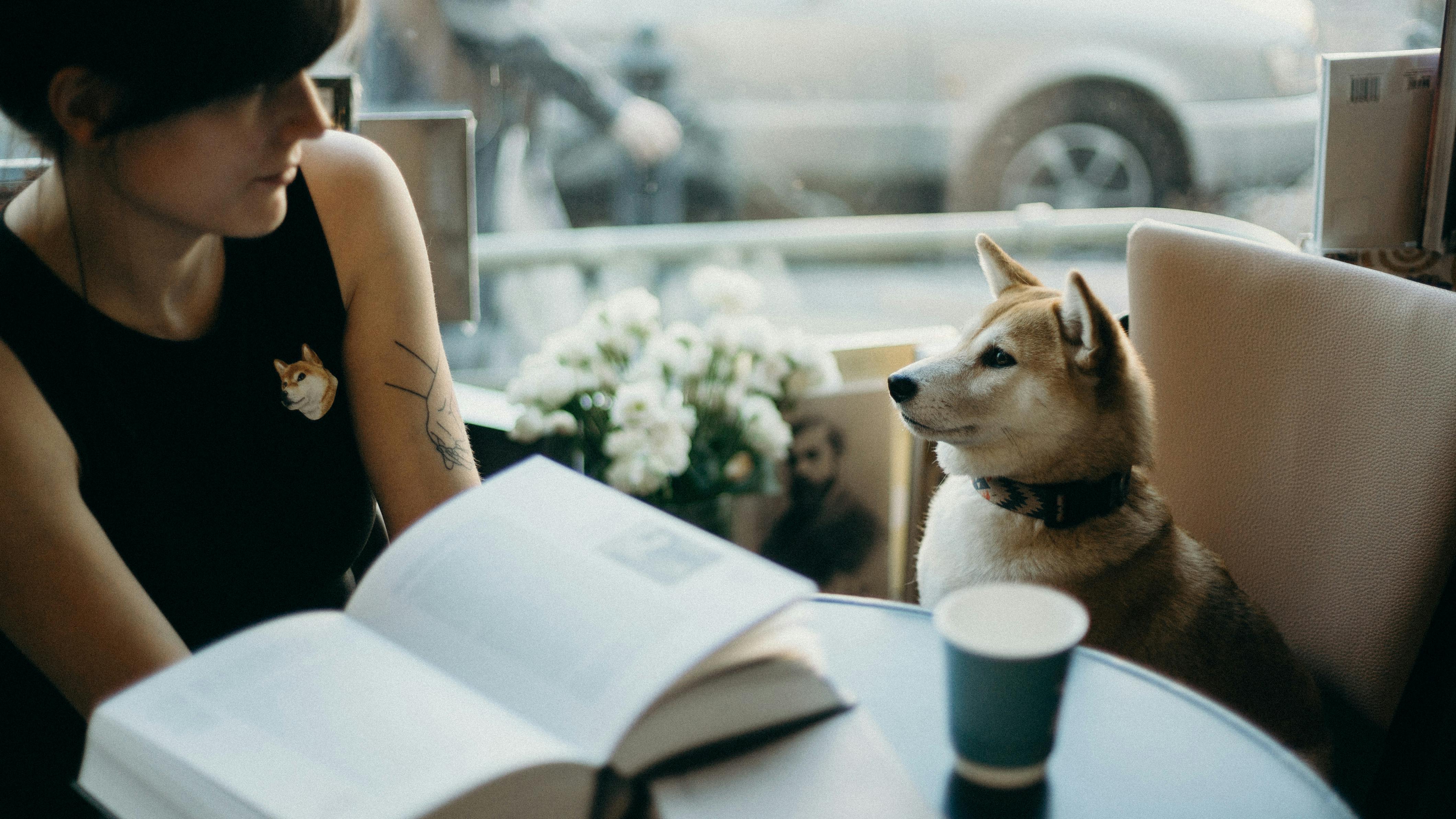 photo of woman beside dog