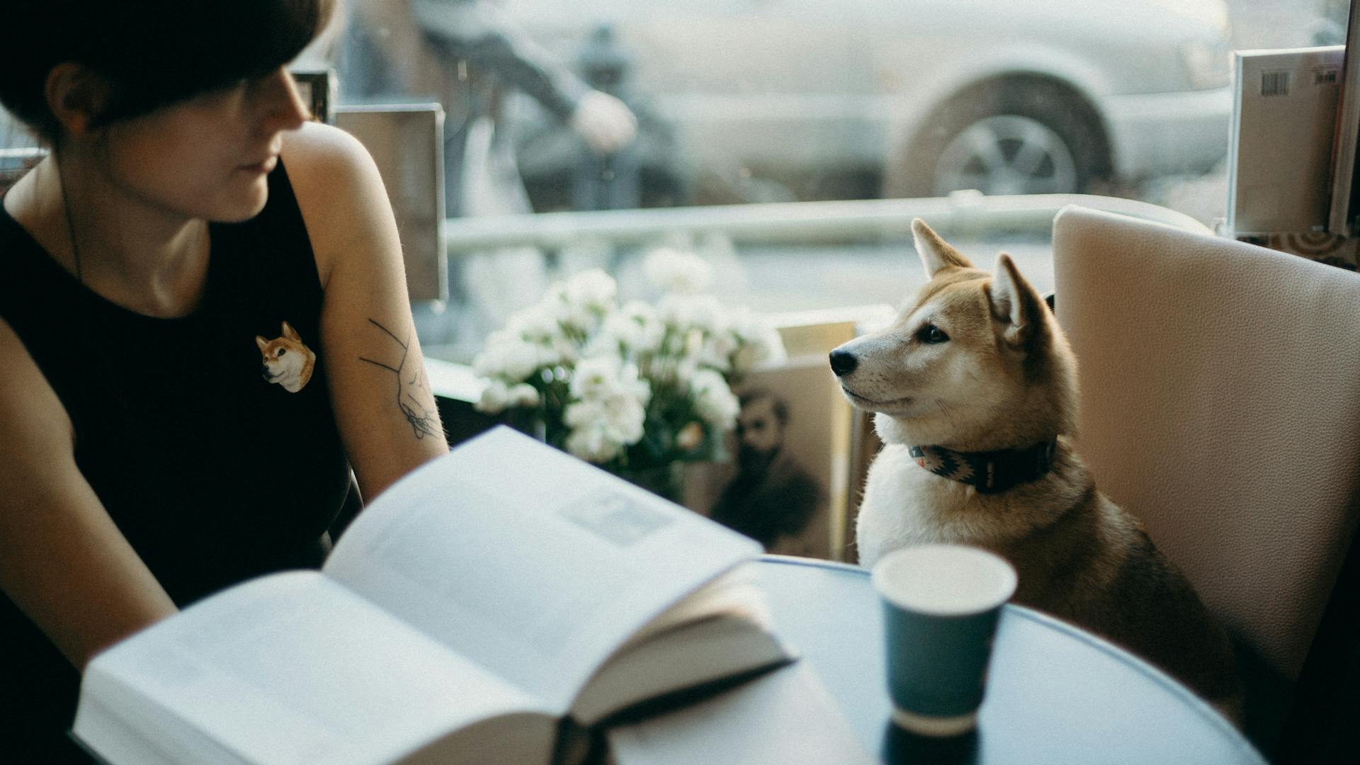 Photo Of Woman Beside Dog