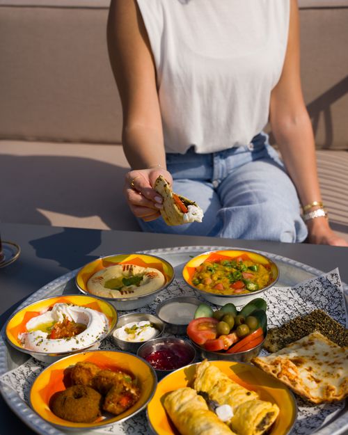 Free A delicious Middle Eastern brunch platter featuring a variety of traditional dishes and fresh ingredients. Stock Photo