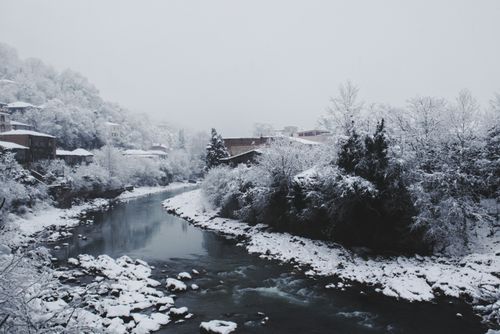 Free Serene snowy river landscape in Kutaisi, Georgia during winter. Stock Photo