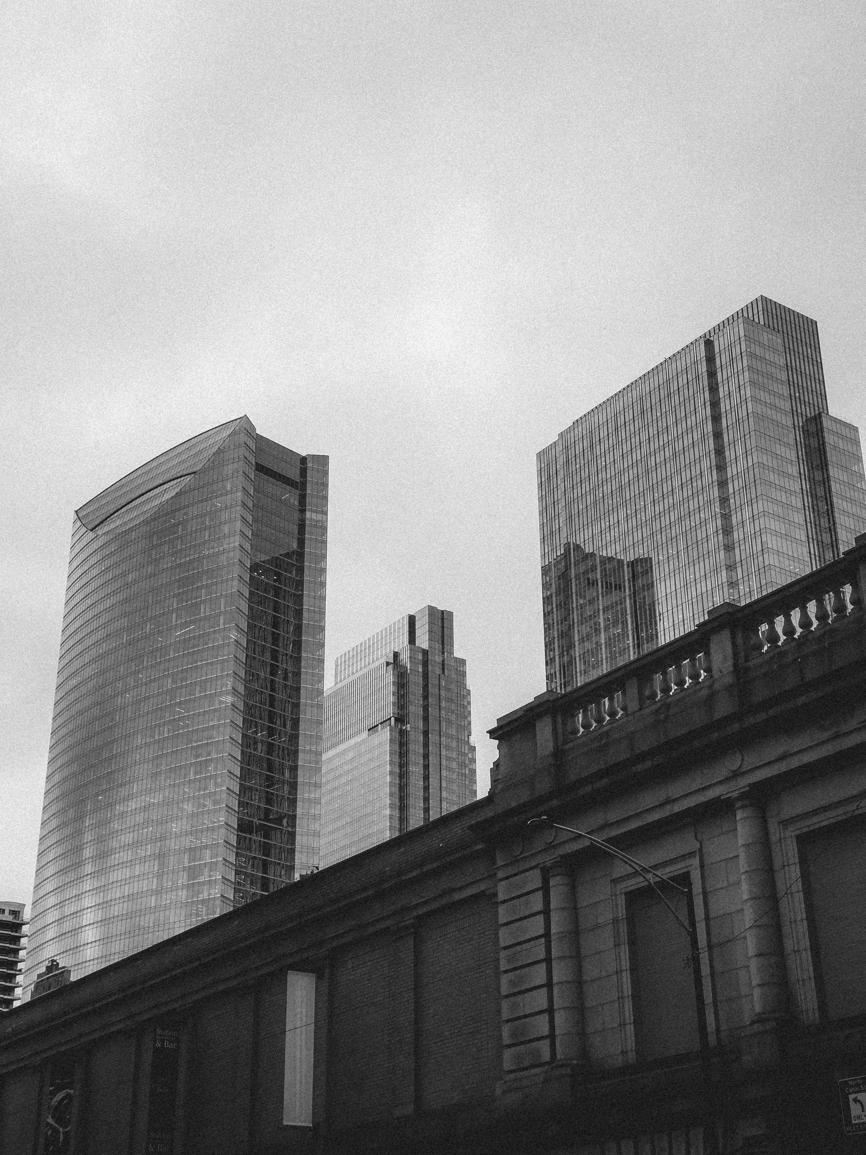 Black and White Urban Skyscrapers Against Sky · Free Stock Photo