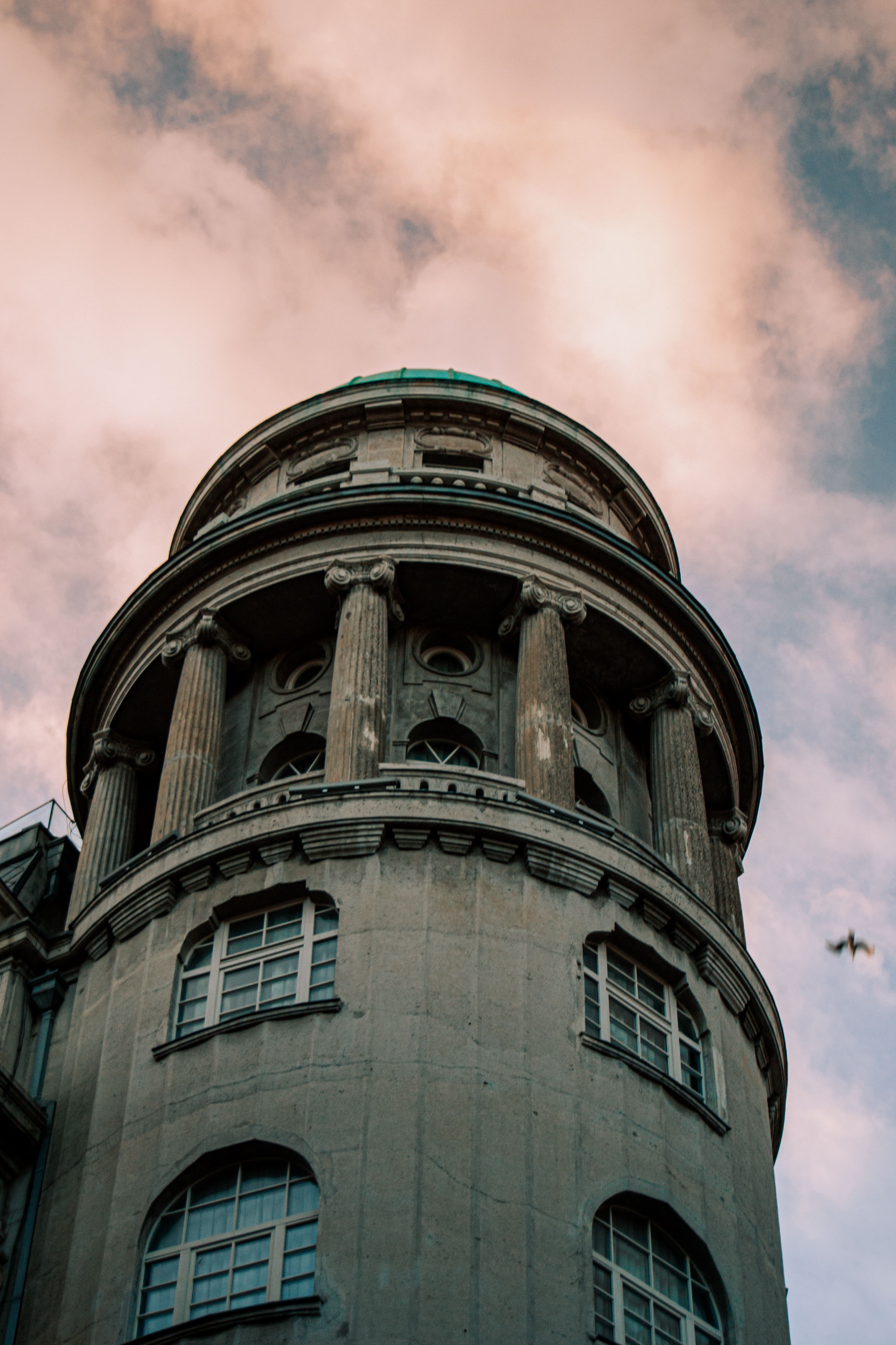 Majestic Historic Building Tower Against Cloudy Sky · Free Stock Photo