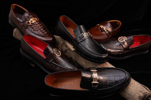 Free A collection of elegant leather loafers displayed artistically with rich textures and colors. Stock Photo